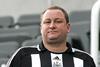 Sports Direct has hit out at shareholders for rejecting Mike Ashley’s bonus scheme as profits jump in its fourth quarter.