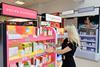 A Boots Beauty Specialist prepares the shelves at new beauty hall in Fareham