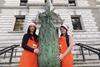 B&Q employees deliver a Christmas tree to Her Majesty's Treasury