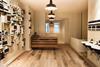 Untreated and stripped wooden boards and overhead pendant lights complete the effect.