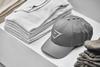 Gymshark branded baseball caps on display in its Dubai store