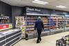Man browsing in Iceland Supermarket