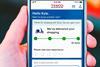 Mobile showing Tesco Whoosh order tracker in a customer's hand