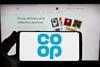 Co-op logo on phone held up against background of Co-op website