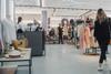 People shopping in fashion section of a store