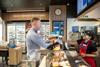 Customer being served at Greggs store