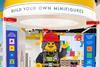 Lego on display at Cribbs shopping centre, Bristol. Sign says: 'Build your own minifigures'