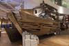 The ground floor features a full-size boat crafted from driftwood