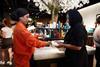Colleague serving customer at Rituals' Oxford Street store