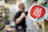 Co-op x Aldi price match label in store