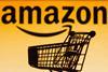 Amazon logo on a yellow background with a trolley in the foreground