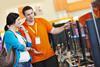 Colleague and customer in electricals shop