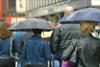 Shoppers in rain