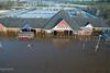 Aerial photographs of a Tesco Extra store in Cumbria showed the extent of the flooding in the North West.