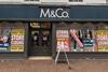 Exterior of M&Co in Nantwich, Cheshire with 'Closing down' signs in window