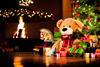 Teddy-bear,-rocking-horse-and-gifts-under-Christmas-tree