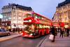 Shoppers and a red bus on Oxford Street