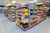 Essential groceries like condiments, cooking sauces, rice and canned goods fill the shelves at the first Morrisons Daily store, in Crewe.