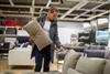 Woman buying a sofa in a furniture store