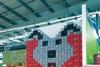 Asda store workers get into the Easter spirit with Coke can display