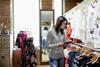 Worker checking stock in fashion store