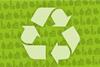 Green recycling symbol on a background of products