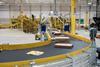 Amazon parcels on conveyor belt at delivery station