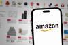 Amazon logo on phone against website background