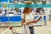 Supermarket shopper with receipt