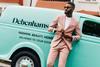 Model in suit next to Debenhams delivery van