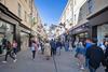 Shoppers walking down high street in Bath