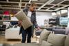 Woman buying sofa in store