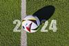 Football pitch with text saying 2024 and a football