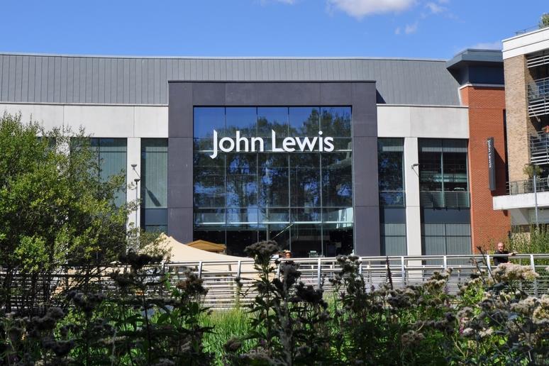 John Lewis chair White wins backing for future amid investment row