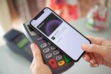 Customer-paying-with-phone-using-Apple-Pay