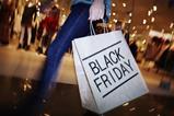 Lady holding a black Friday shopping bag