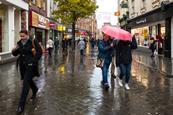 Shoppers on rainy high street