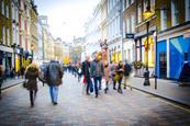 Blurred image of shoppers on high street