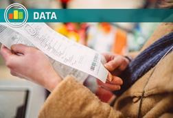 Shopper looking at receipt