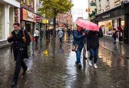 Shoppers on rainy high street