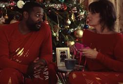 Very Christmas ad 2022 screengrab shows man and woman by a Christmas tree