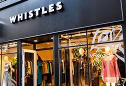 Whistle store sign