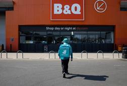 Deliveroo driver outside a B&Q store