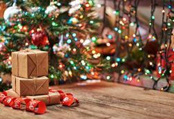 Packages in front of a Christmas tree