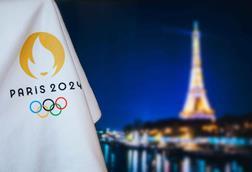 Paris-branded Olympics flag in front of Eiffel tower