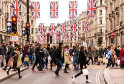 Tourists and shoppers crossing busy Regents Street
