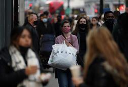 Shoppers on Oxford Street face masks