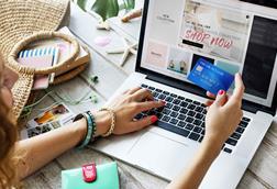 Woman-using-credit-card-to-shop-online-index