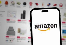 Amazon-logo-on-phone-against-website-background