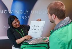Uber Eats rider collecting a bag of John Lewis products